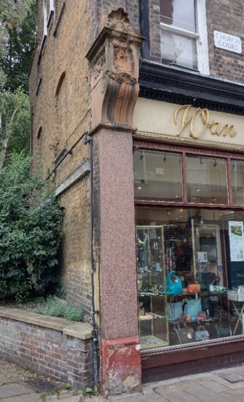 Historic shopfront pilaster and masonry corbel bracket, Church Court