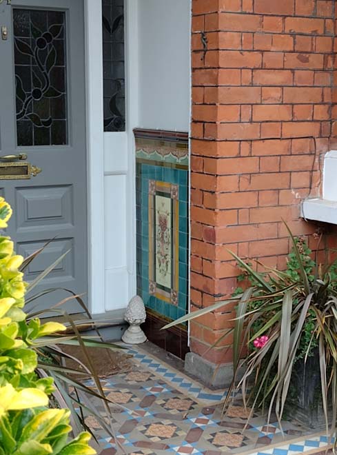 Fig. 71:  Decorative tiles flanked the entrances with inset porches