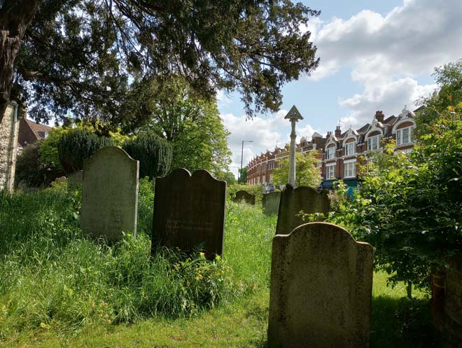 Figure 117: The churchyard with the shopping parades in the background